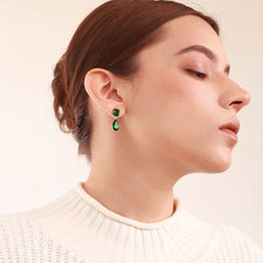 Emerald Essence Drop Earrings with 18K gold plating and a deep emerald-green accent.