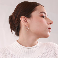 Minimalist 18k gold-plated circular hoops called Golden Glow, lightweight and perfect for everyday wear with a modern, elegant design.