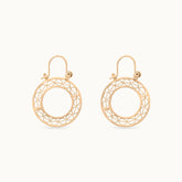 Minimalist 18k gold-plated circular hoops called Golden Glow, lightweight and perfect for everyday wear with a modern, elegant design
