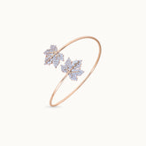 Close-up of the intricate leaf details on the gold bracelet