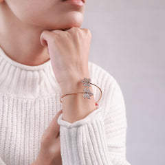 18K gold-plated leaf bracelet worn on a wrist