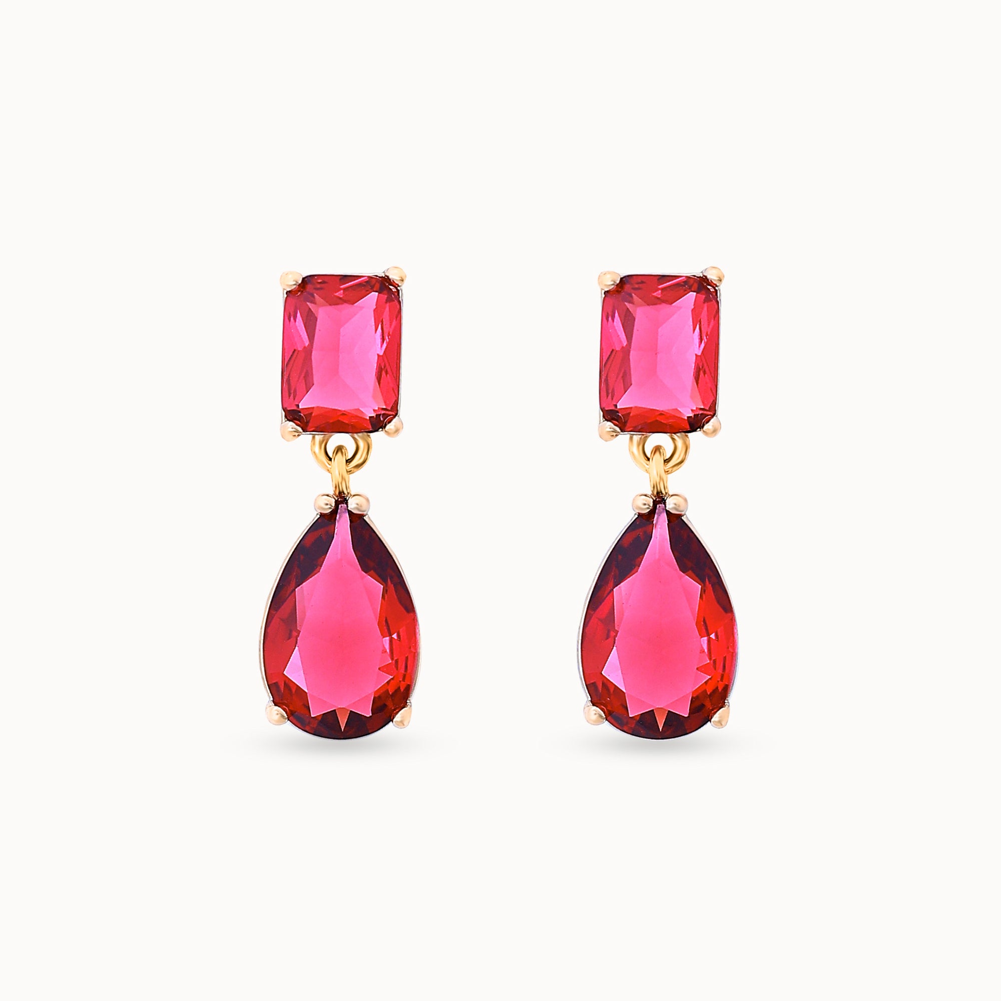 Close-up view of Ruby Dew Drops 18K gold-plated teardrop earrings, showcasing the intricate design and ruby-colored stones