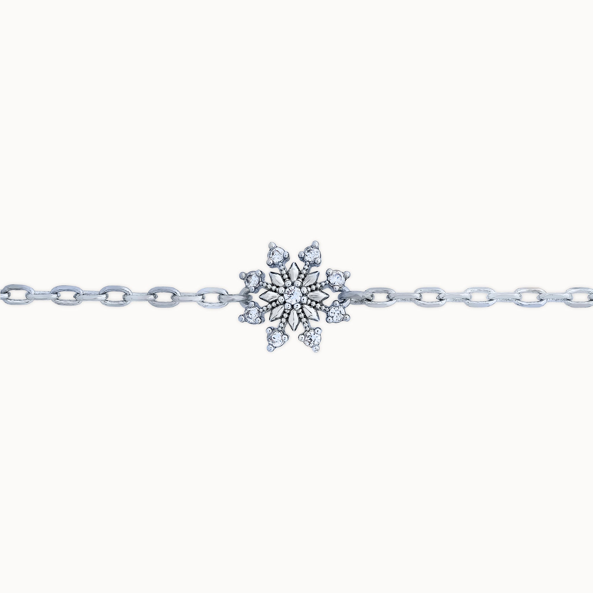 Closeup of Platinum plated bracelet with silver sparkle snowflake design