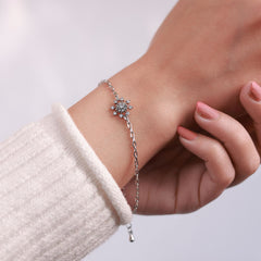 Platinum plated bracelet with silver sparkle snowflake design