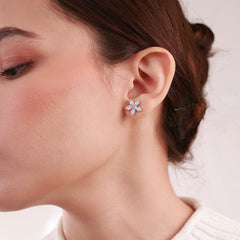 Platinum-plated asymmetrical earrings featuring a star-shaped stud and a sleek clip-on design with a diamond-like finish, perfect for celestial elegance.